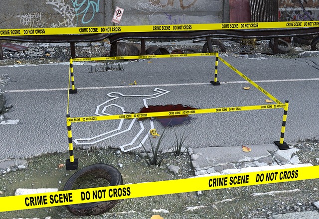 crime scene with crime tape and body tape on ground