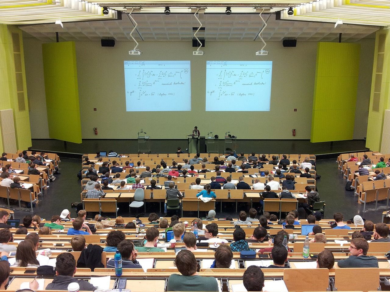 very large college lecture classroom filled with students