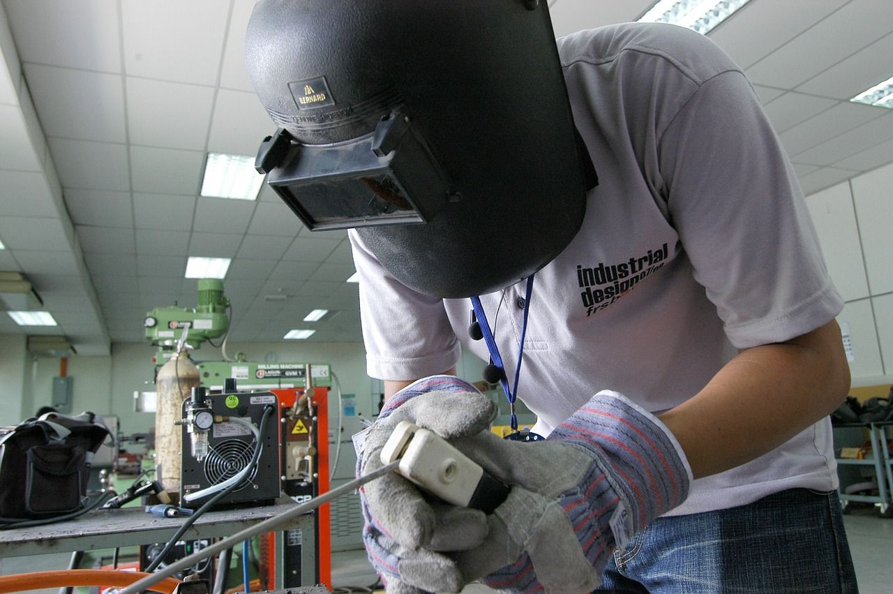 welder doing work with his protective helmet on