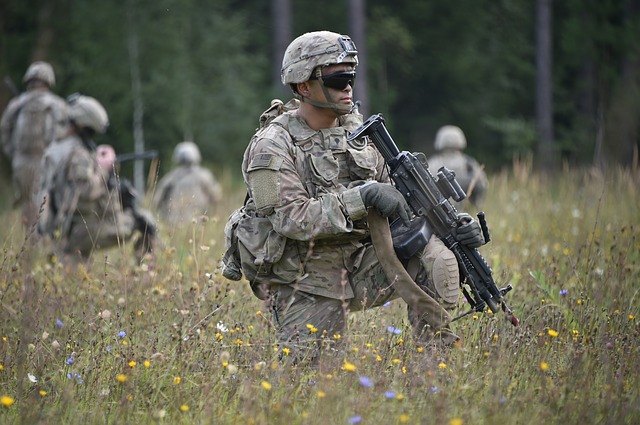 solders on patrol in grass