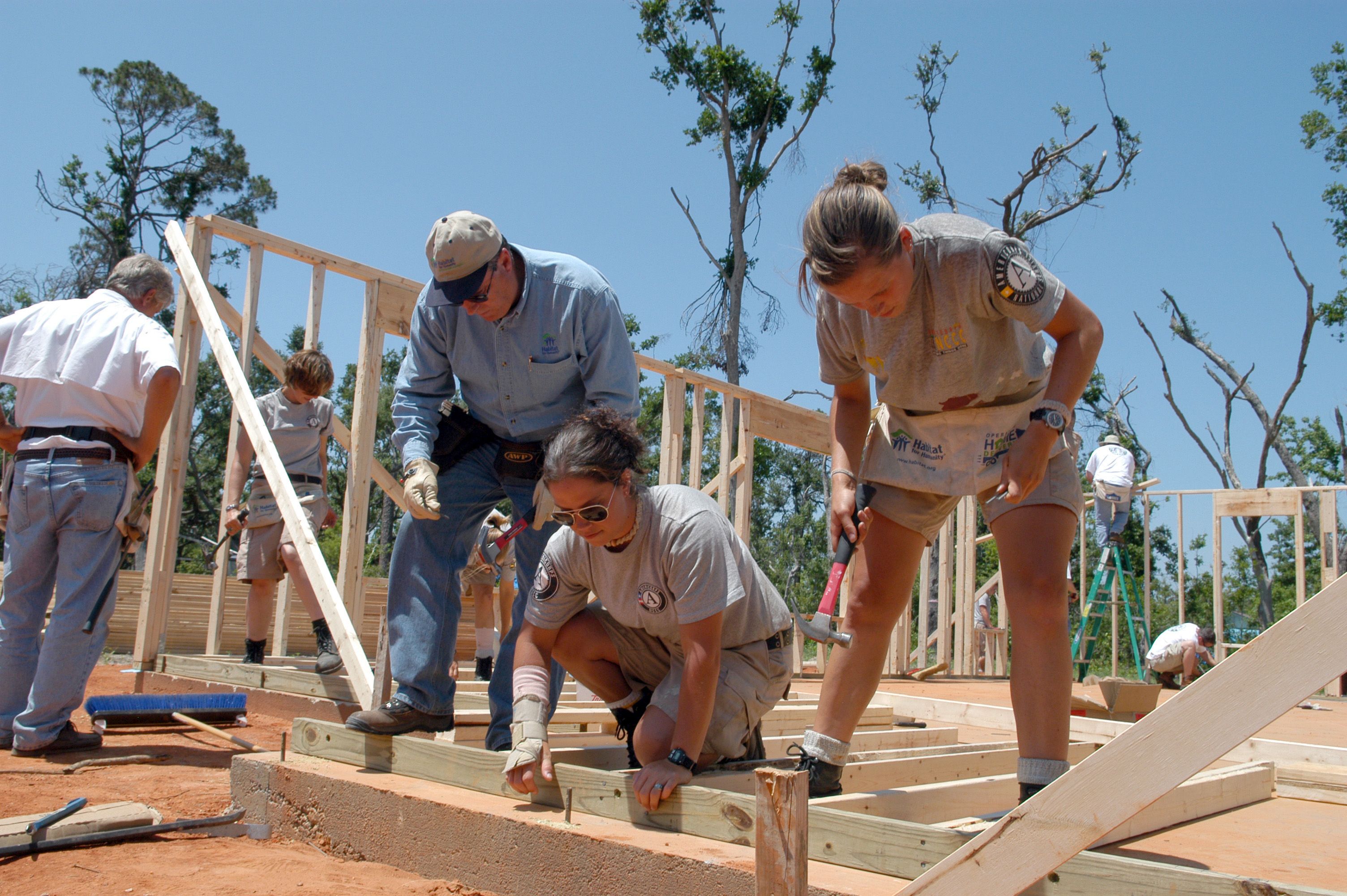 AmeriCorps workers building a house