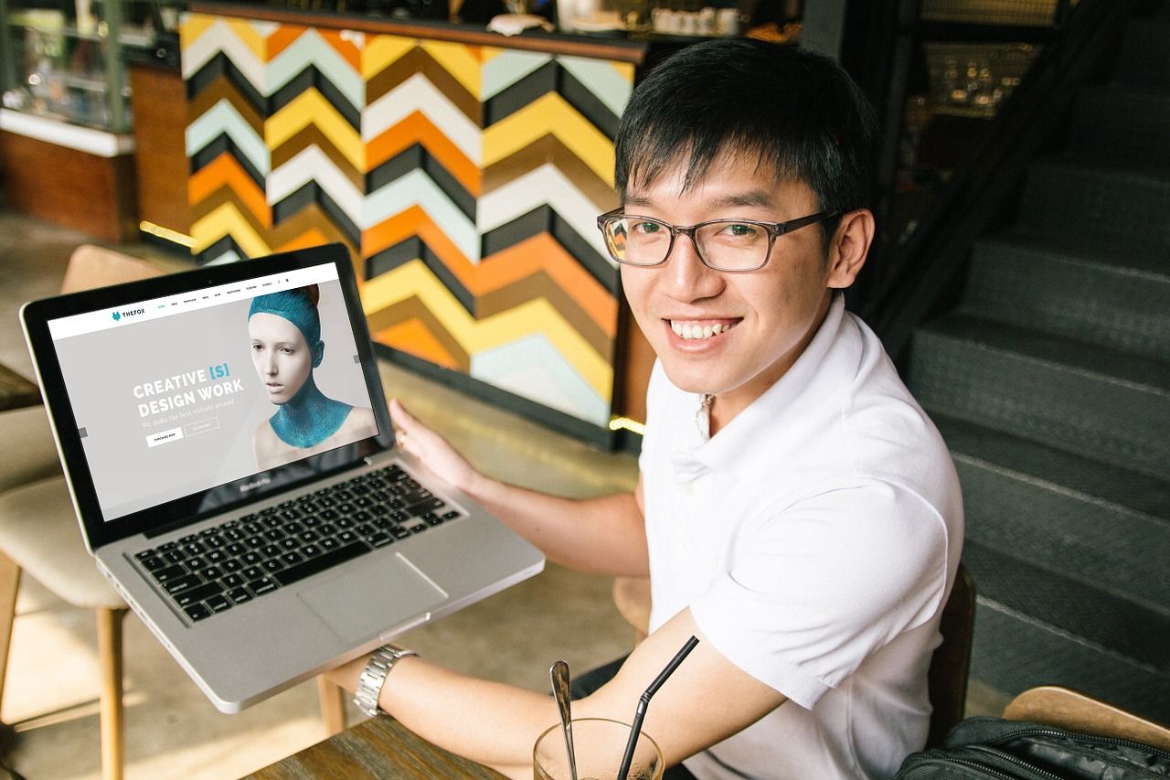 man with an MBA and his laptop computer who wors at a business