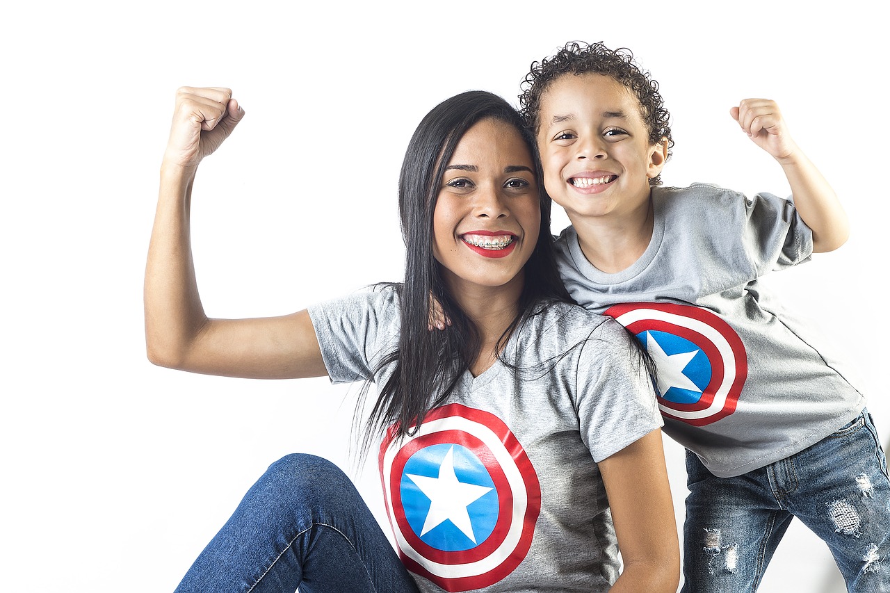 mother and childmaking muscle wearing Captain America shirts