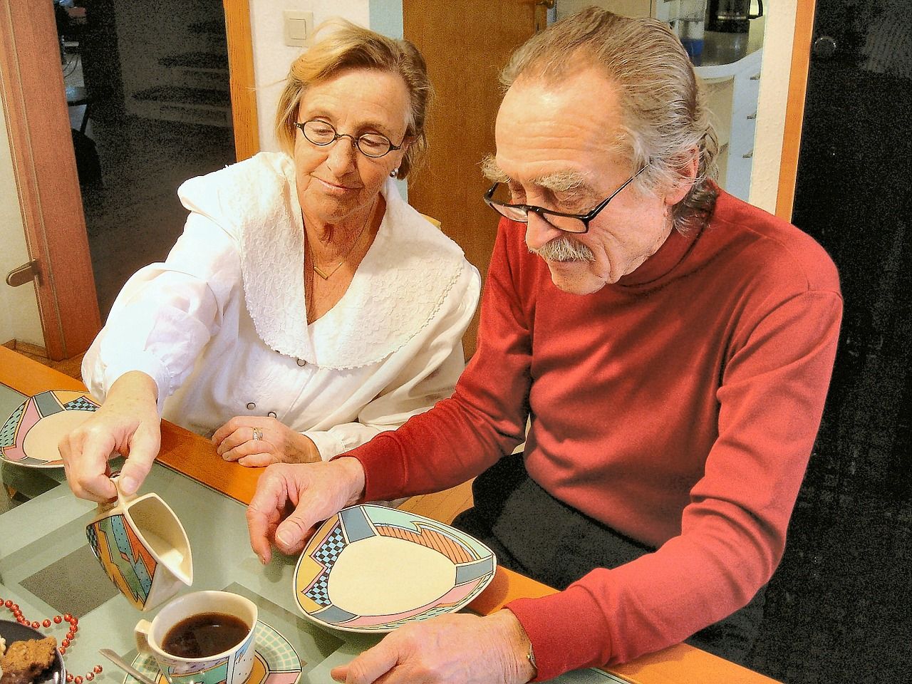 Aide to Elderly helping elder to eat