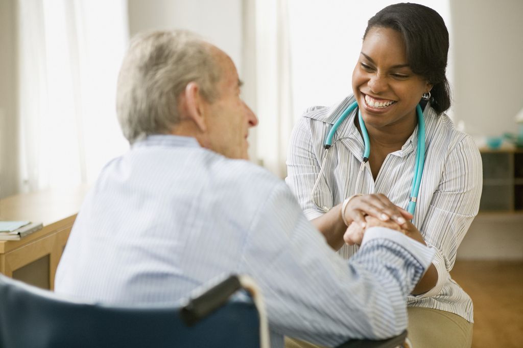 African American nurse with elderly man