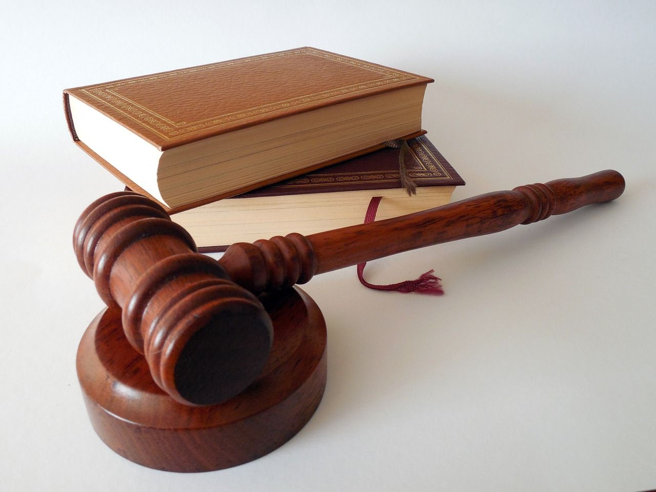 law books next to gavel and sound block